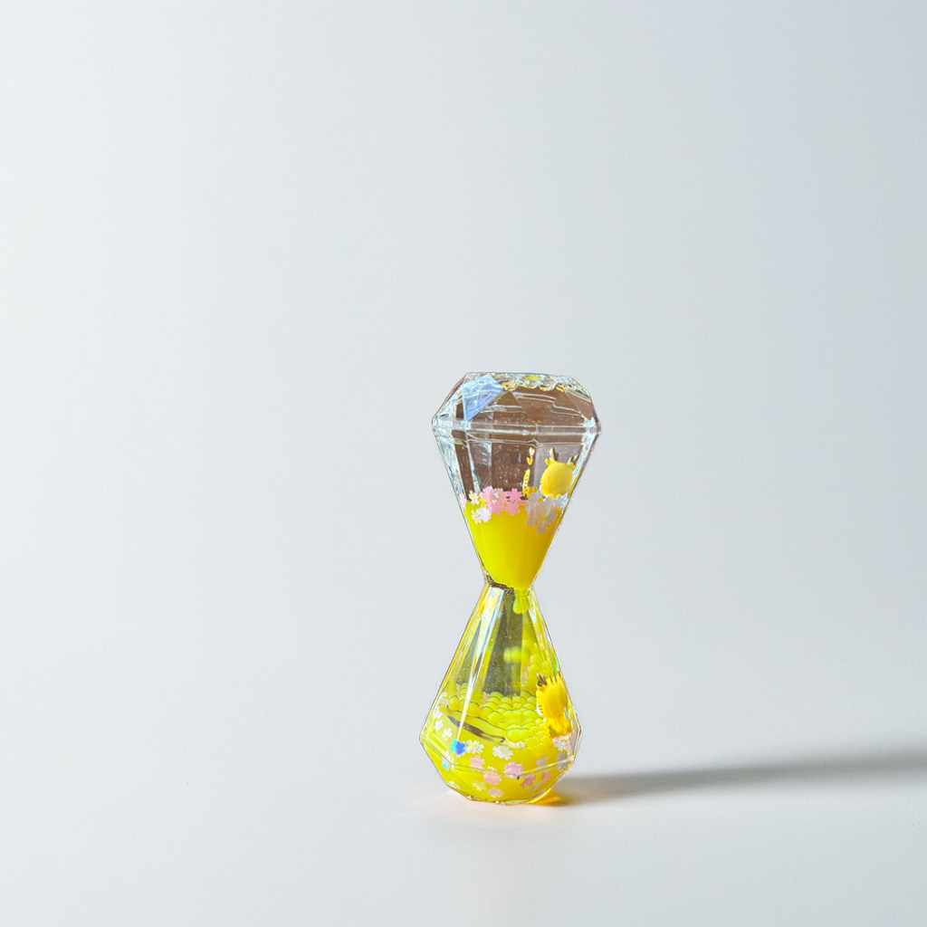 Aurappy Mesmerizing Hourglass Two Minutes Timer yellow color featuring soothing droplet movement, perfect for stylish home décor and elegant desk accents