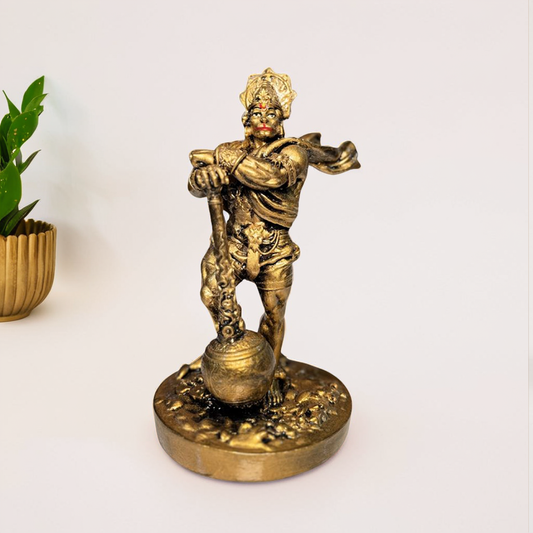 Bronze statue of Hanuman on a white background