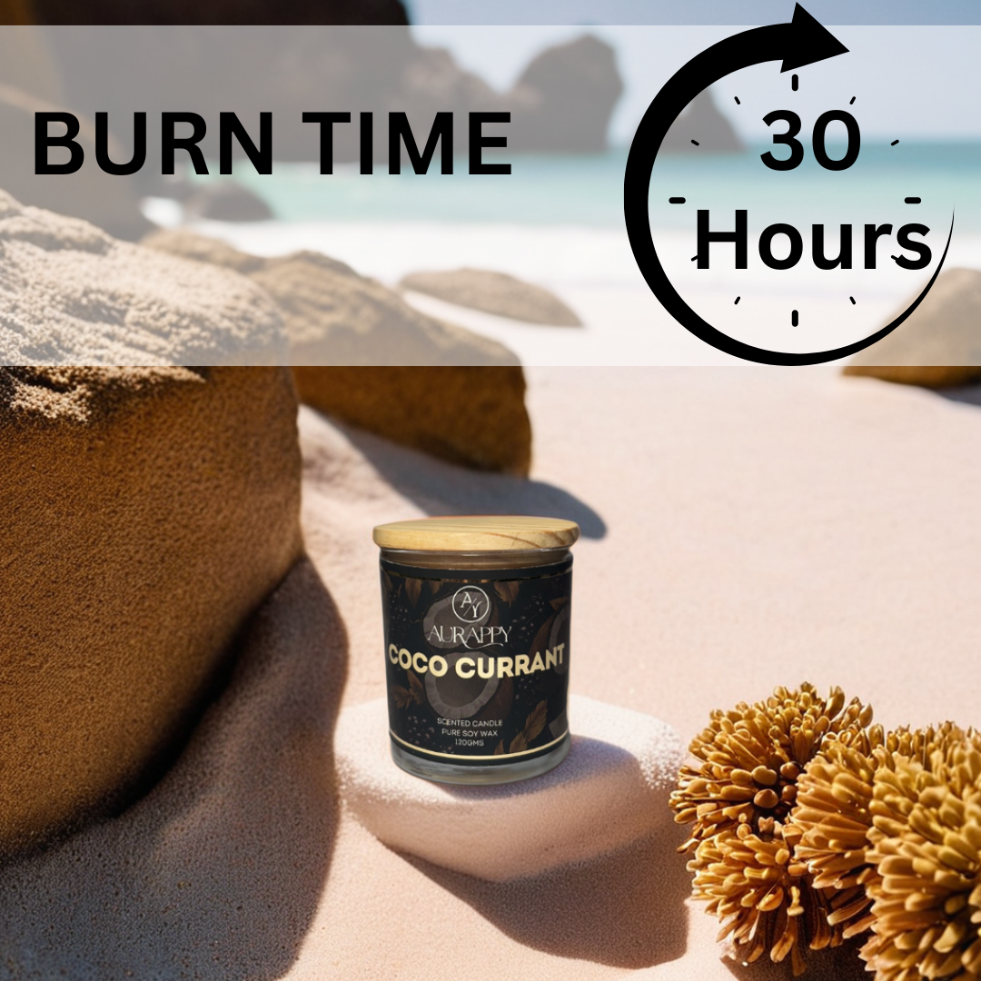 Candle labeled 'Coco Currant' on a sandy surface with '30 Hours Burn Time' text.
