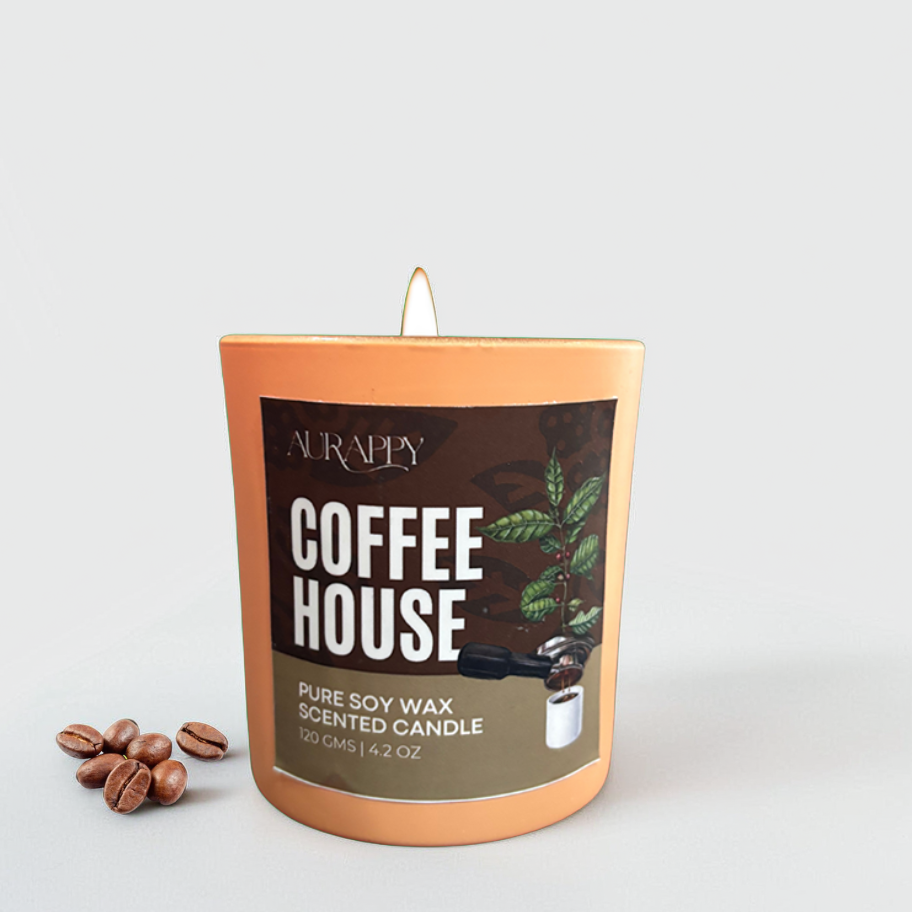 Candle labeled 'Coffee House' with coffee beans on a light gray background