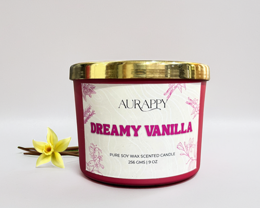 Aurappy Dreamy Vanilla candle with a gold lid on a white background