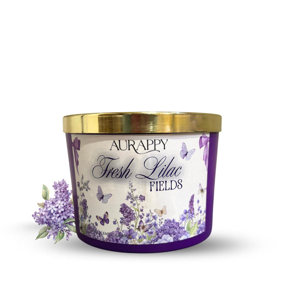 Aurappy Fresh Lilac Fields candle with a gold lid on a white background