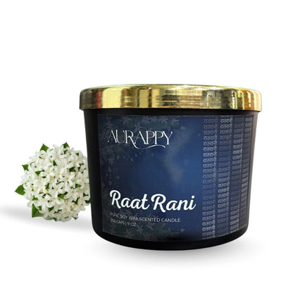 Aurappy Raat Rani candle with a gold lid and white flowers on a white background