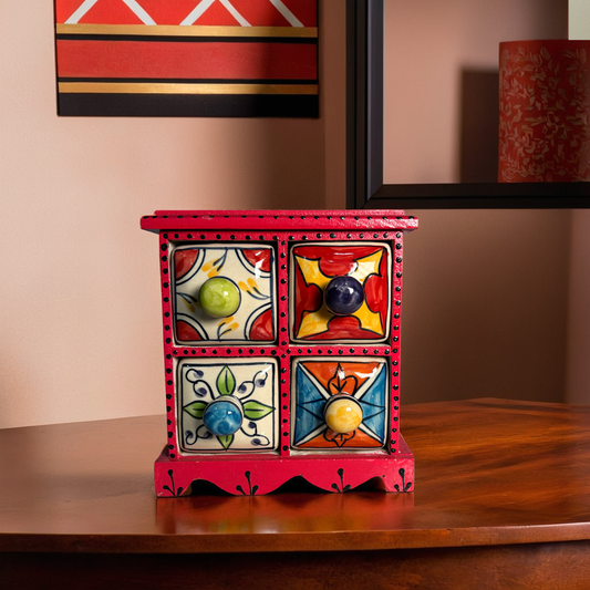 Handmade wooden chest with four colorful ceramic drawers, perfect for organizing small items. Adds a rustic, boho touch to any space.