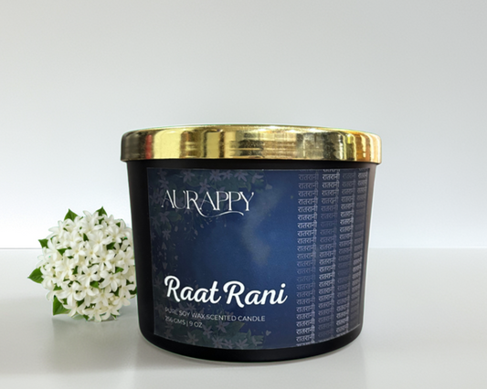 Aurappy Raat Rani candle with a gold lid on a white background